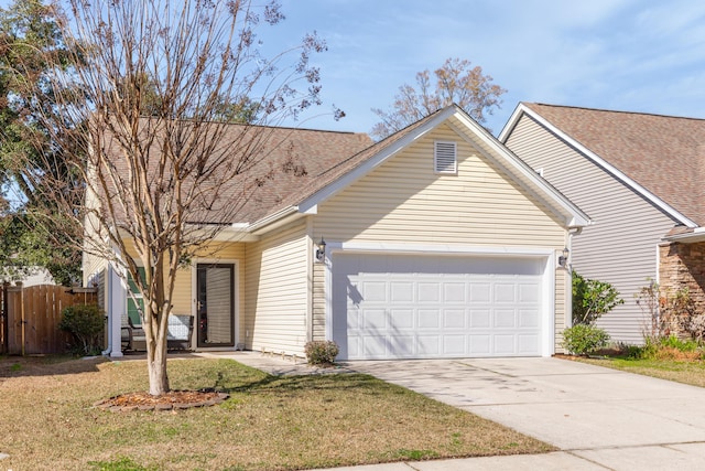 single story home with a garage, concrete driveway, a front yard, and fence