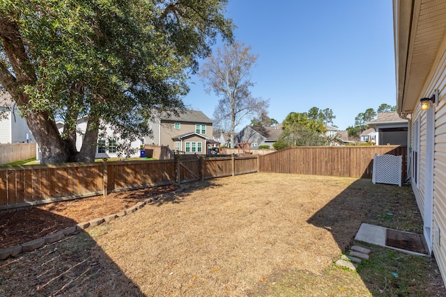 view of yard with a fenced backyard