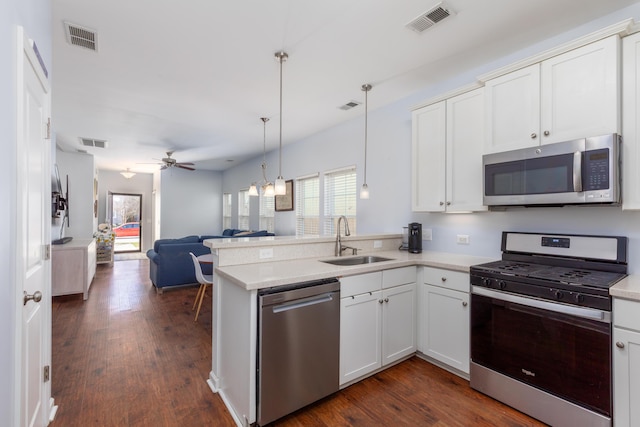 kitchen featuring visible vents, appliances with stainless steel finishes, and a sink