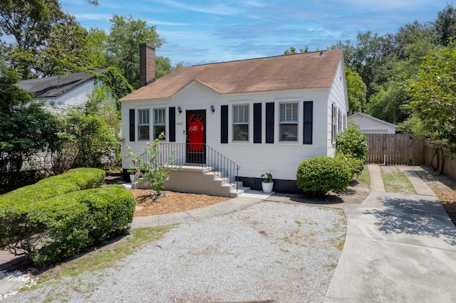 4932 N Rhett Ave, North Charleston, SC 29405 - bungalow-style home with roof with shingles, a chimney, and a gate