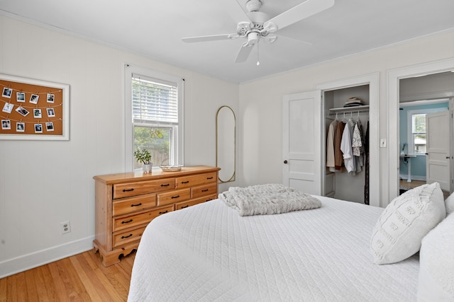 4932 N Rhett Ave, North Charleston, SC 29405 - bedroom featuring baseboards, light wood-style flooring, a closet, crown molding, and a ceiling fan