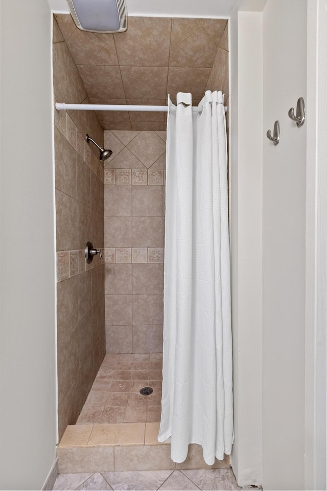 4932 N Rhett Ave, North Charleston, SC 29405 - bathroom with tiled shower and tile patterned floors