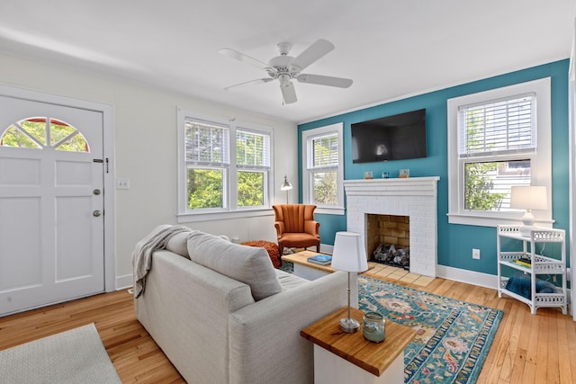 4932 N Rhett Ave, North Charleston, SC 29405 - living area with healthy amount of natural light, hardwood / wood-style flooring, a fireplace, and ceiling fan
