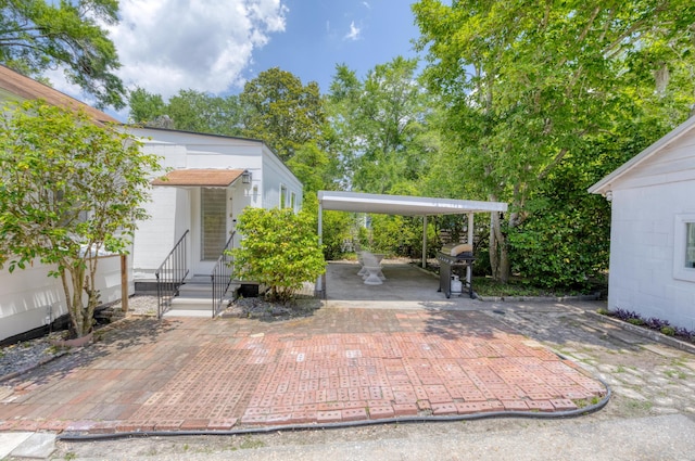 4932 N Rhett Ave, North Charleston, SC 29405 - view of patio with entry steps and a grill