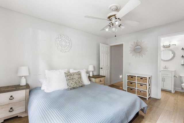 7935 Parklane Ct Unit A, North Charleston, SC 29418 - bedroom featuring wood finished floors, ensuite bath, baseboards, a ceiling fan, and a sink
