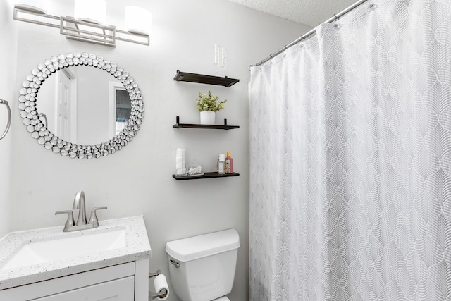 7935 Parklane Ct Unit A, North Charleston, SC 29418 - bathroom with toilet, vanity, and a textured ceiling