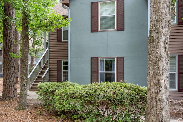 7935 Parklane Ct Unit A, North Charleston, SC 29418 - view of side of property with stucco siding and stairs