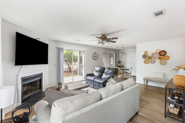 7935 Parklane Ct Unit A, North Charleston, SC 29418 - living room with ceiling fan, a fireplace with flush hearth, and wood finished floors