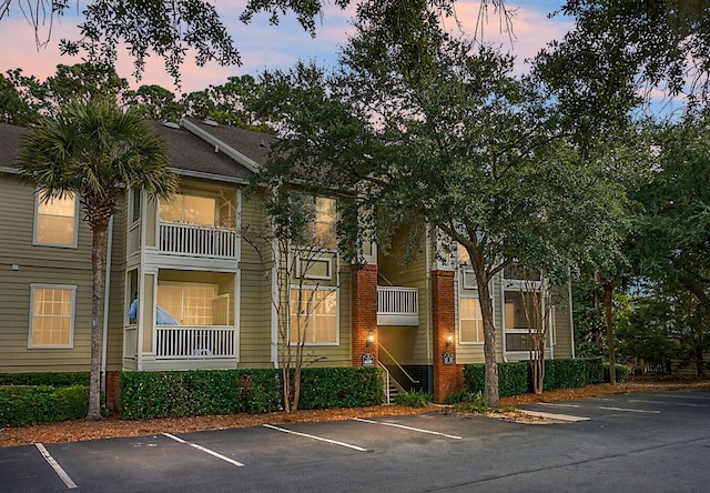 view of outdoor building at dusk