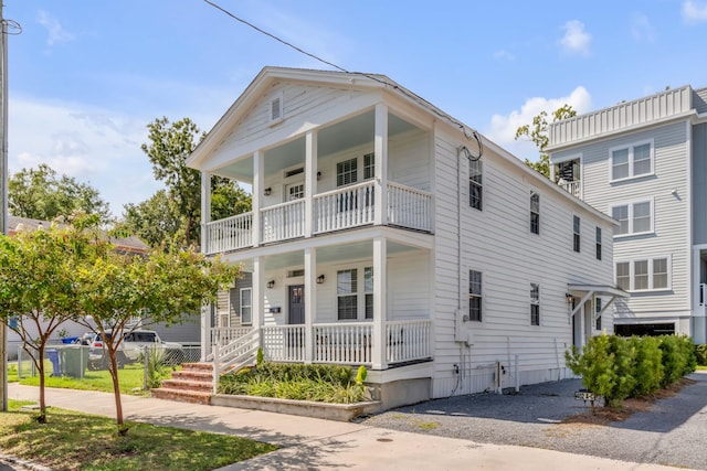 view of front of home featuring a balcony and a porch