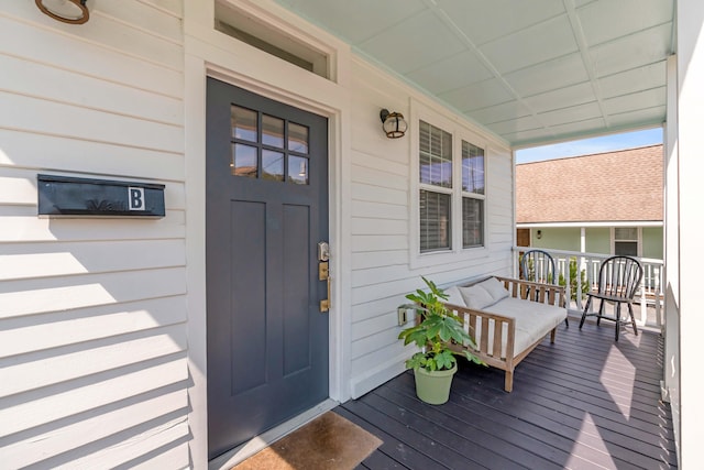 doorway to property featuring covered porch