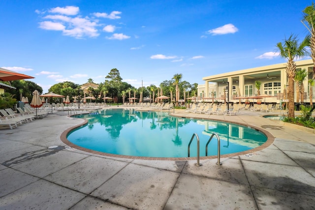 community pool featuring a patio area