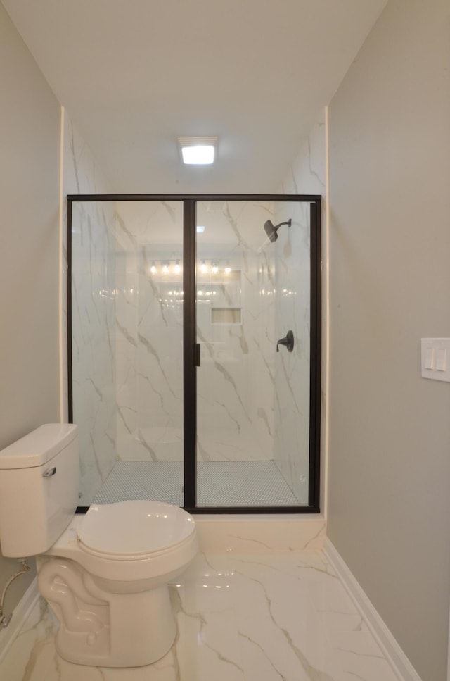 bathroom featuring toilet and walk in shower