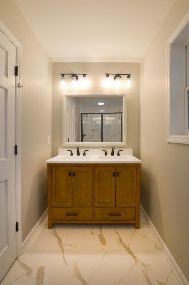 bathroom with walk in shower and vanity