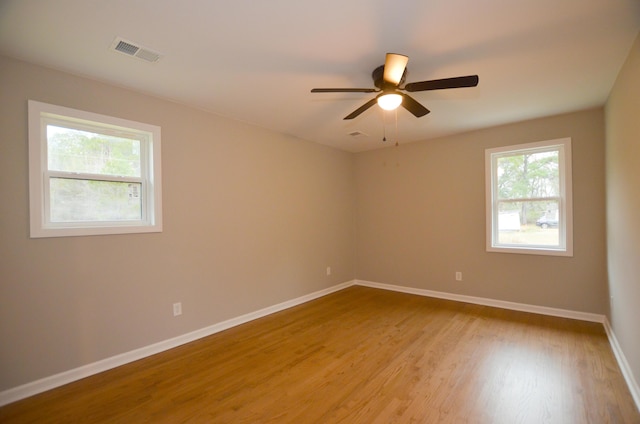 empty room featuring ceiling fan and light wood-type flooring