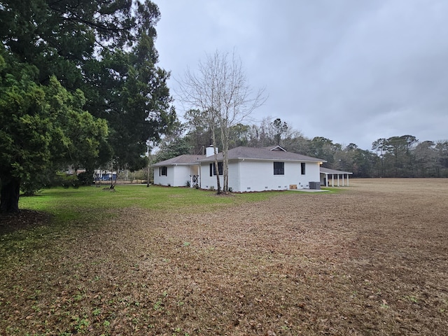 back of house with a yard