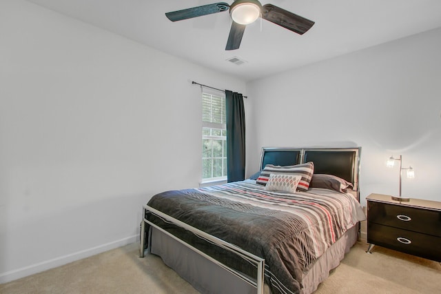 bedroom with carpet floors, baseboards, a ceiling fan, and visible vents