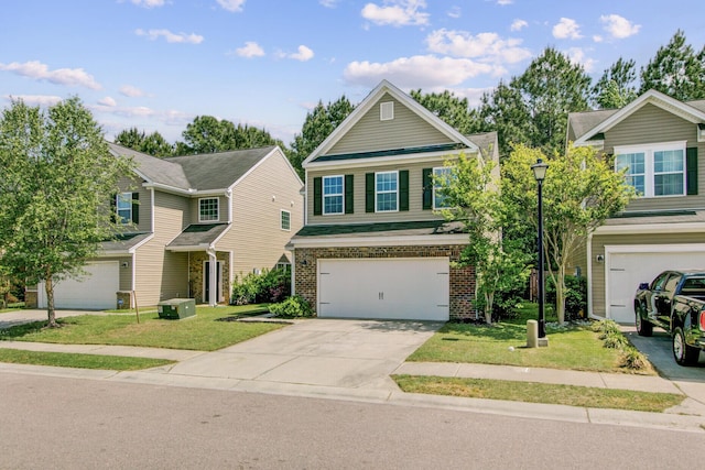 view of front of house with a garage, driveway, and a front lawn