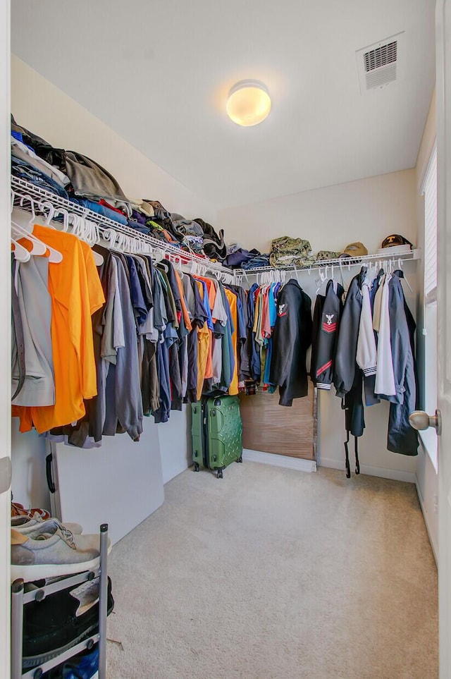walk in closet with carpet flooring and visible vents