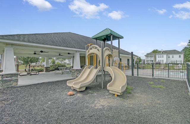 community jungle gym with fence and ceiling fan