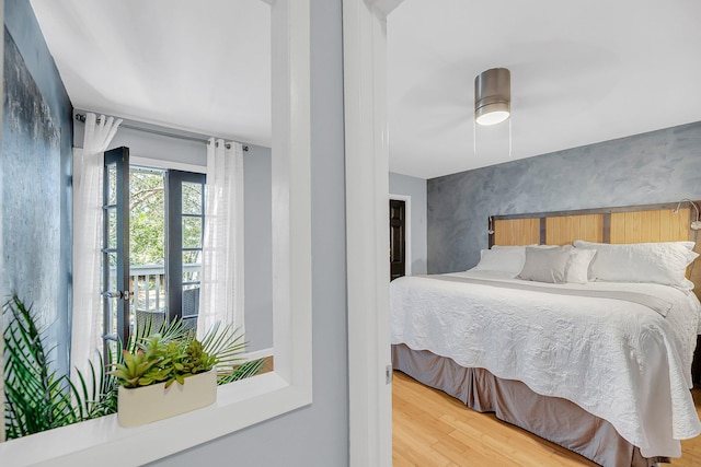 bedroom featuring ceiling fan and wood finished floors