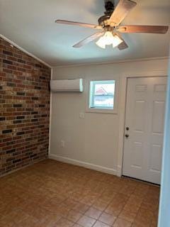 4324 Purdue Dr, North Charleston, SC 29418 - foyer featuring a wall unit AC, brick wall, a ceiling fan, crown molding, and baseboards