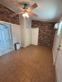 4324 Purdue Dr, North Charleston, SC 29418 - unfurnished bedroom featuring brick wall and a ceiling fan