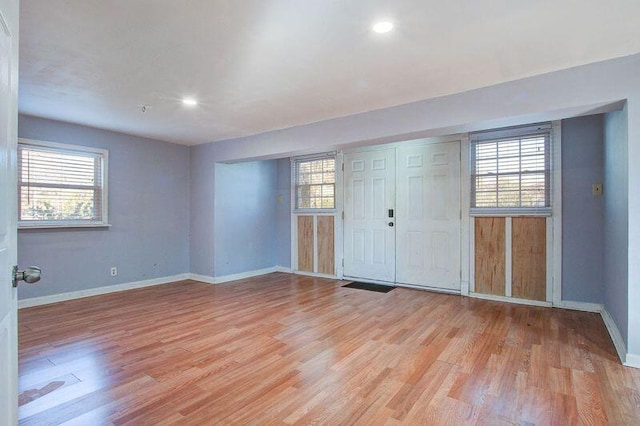 spare room featuring light hardwood / wood-style floors