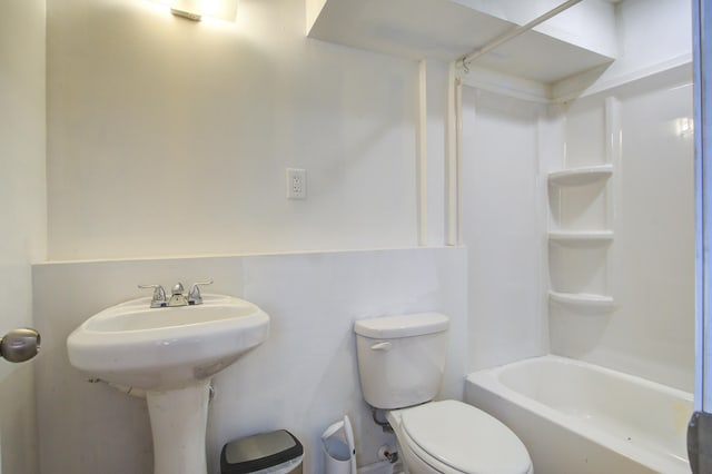 bathroom with bathtub / shower combination and toilet