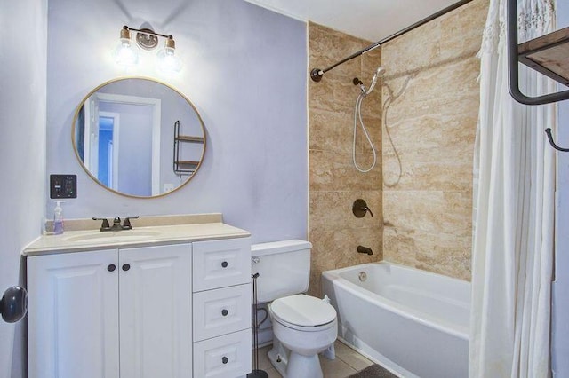 full bathroom featuring tiled shower / bath, vanity, and toilet