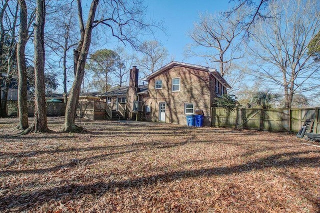 rear view of house with a lawn