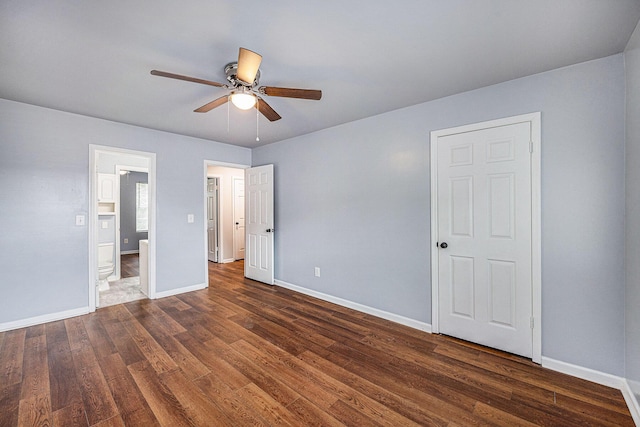 2045 Rondo St Unit B, Charleston, SC 29414 - unfurnished bedroom featuring dark wood-style flooring, baseboards, ensuite bath, and ceiling fan