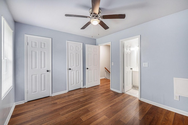2045 Rondo St Unit B, Charleston, SC 29414 - unfurnished bedroom with two closets, wood finished floors, baseboards, ensuite bathroom, and a ceiling fan