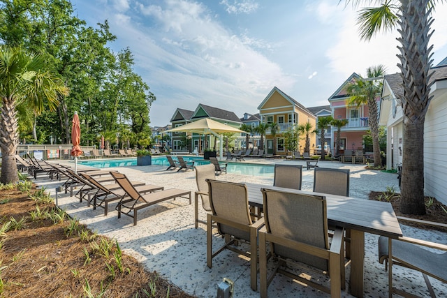 pool featuring a patio and fence