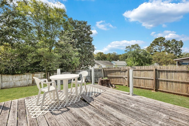 wooden terrace with a yard