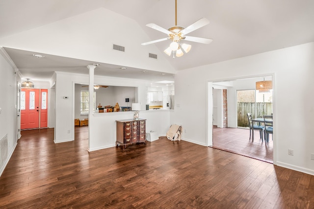 unfurnished living room with high vaulted ceiling, visible vents, ceiling fan, and wood finished floors