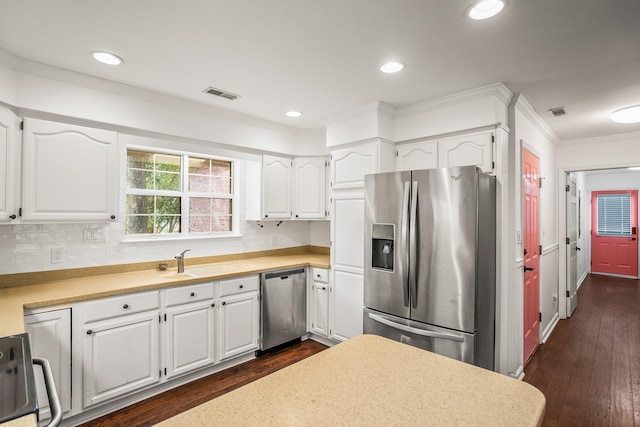 kitchen featuring a sink, visible vents, white cabinets, appliances with stainless steel finishes, and dark wood finished floors