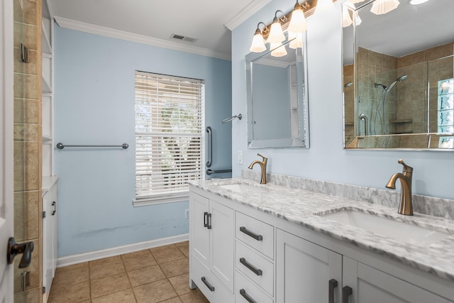 full bathroom featuring crown molding, visible vents, a sink, and a tile shower