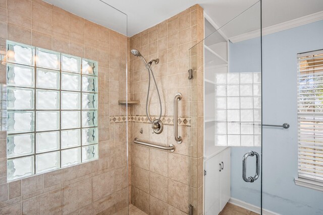 bathroom featuring a stall shower and ornamental molding