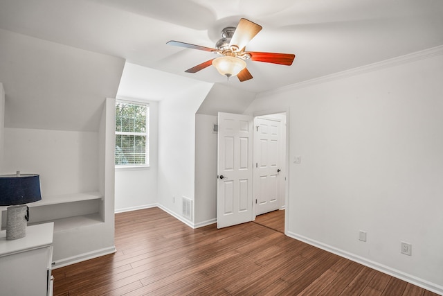 additional living space with vaulted ceiling, ceiling fan, wood finished floors, and baseboards