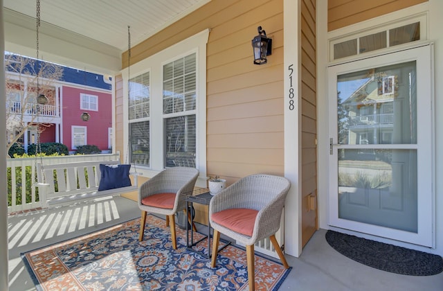 view of exterior entry with covered porch