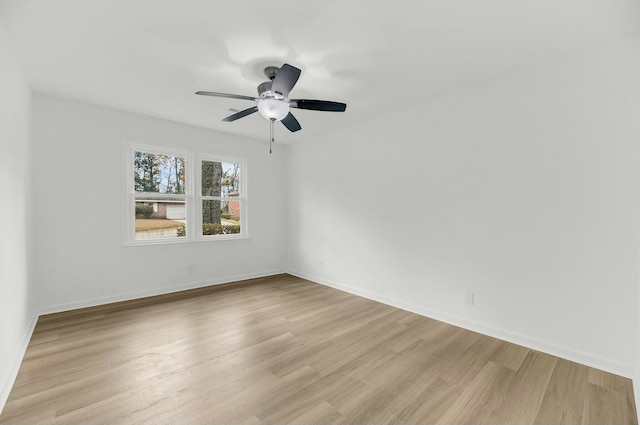 empty room featuring ceiling fan and light wood-type flooring