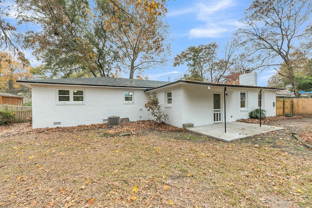 rear view of property featuring a patio area and central AC