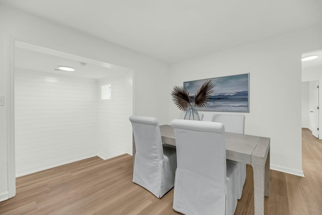 dining area featuring light wood-type flooring