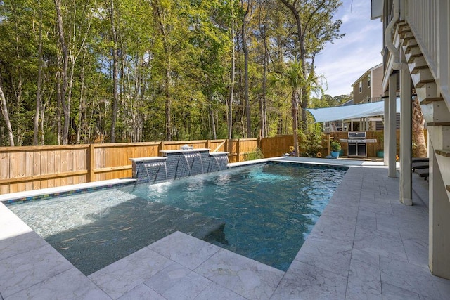 view of pool featuring a fenced in pool and a fenced backyard