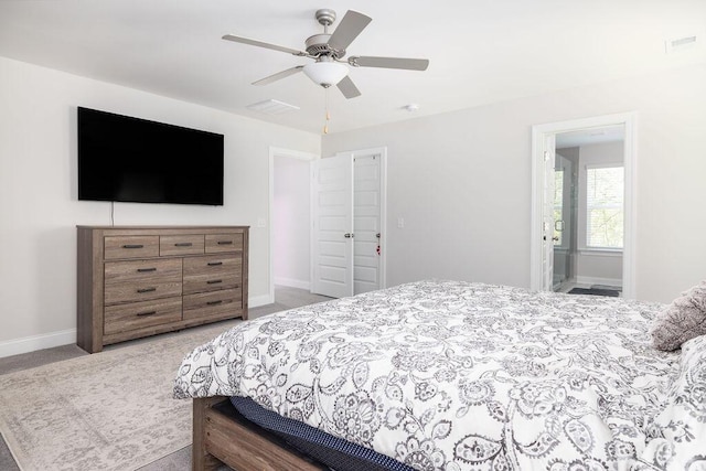 carpeted bedroom featuring baseboards, a ceiling fan, and visible vents