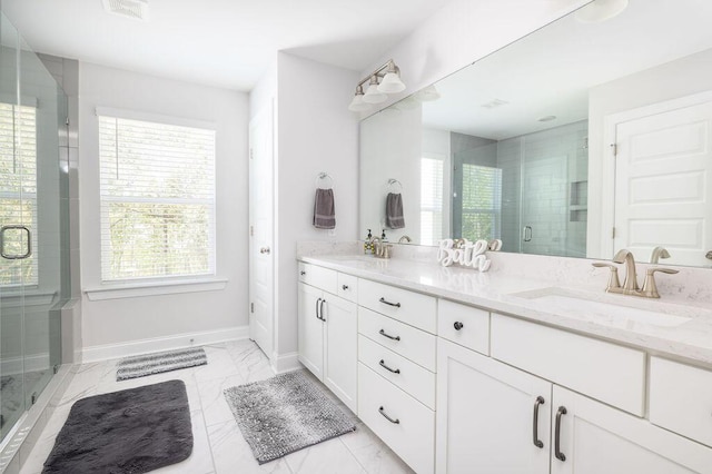 full bath with baseboards, a shower stall, visible vents, marble finish floor, and a sink