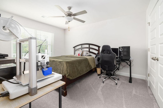carpeted bedroom with ceiling fan, baseboards, and visible vents