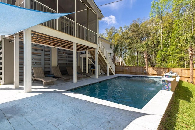 view of pool featuring a fenced in pool, a patio area, a fenced backyard, and stairs
