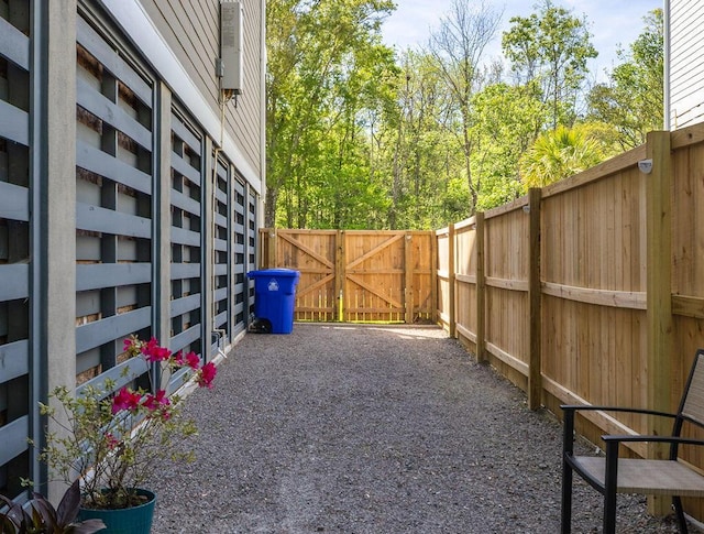 view of yard featuring fence and a gate